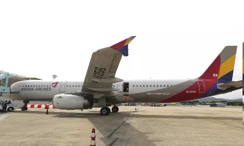 Passenger opens exit door during airplane flight in S Korea; 12 injured