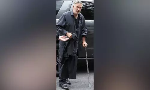 Alec Baldwin steps out with cane after hip surgery