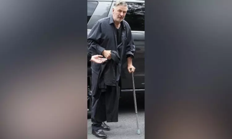 Alec Baldwin steps out with cane after hip surgery