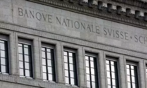 Swiss central bank raises rates again, signals may need to do more