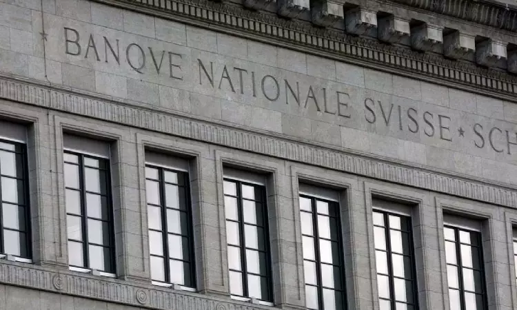 Swiss central bank raises rates again, signals may need to do more