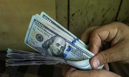 Dollar flat; Aussie slides as inflation slows