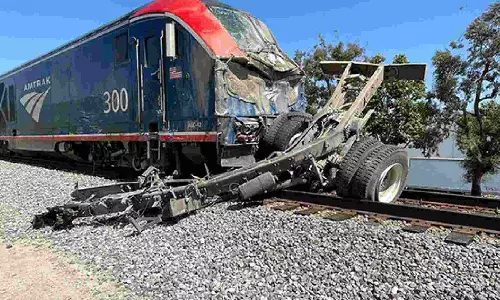 16 injured as Amtrak passenger train derails after hitting vehicle