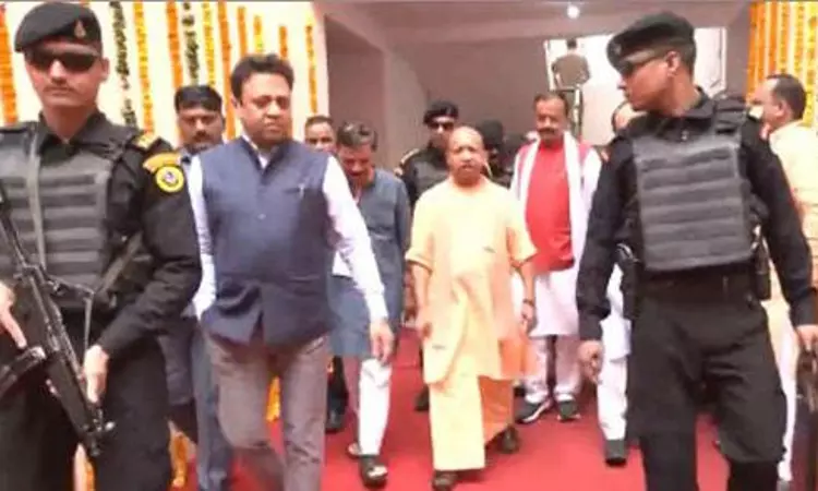 Yogi hands over to beneficiaries flats built on land confiscated from Atiq