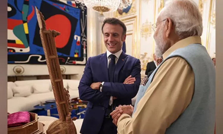 PM Modi gifts sandalwood sitar to French President Macron PM Modi gifts sandalwood sitar to French President Macron