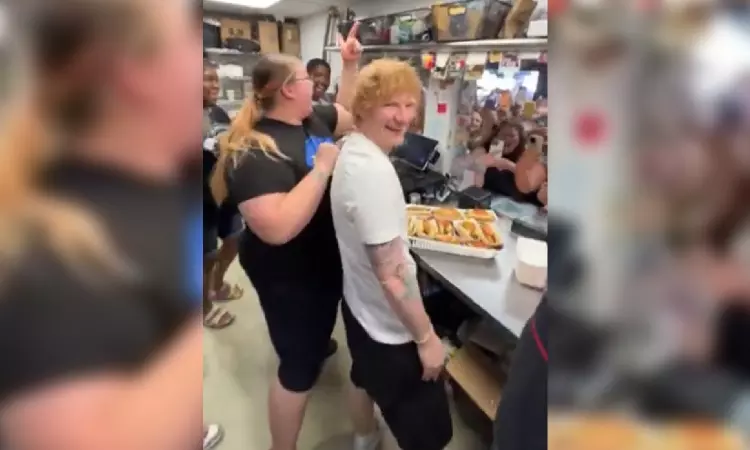 Ed Sheeran spotted serving hot dogs before sell-out concert Ed Sheeran spotted serving hot dogs before sell-out concert