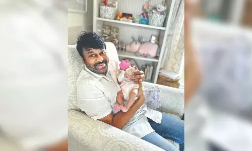Chiranjeevi smiles holding newborn granddaughter on bday Chiranjeevi smiles holding newborn granddaughter on bday