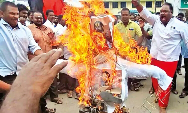 DMK cadre burn seer’s effigies in Vellore DMK cadre burn seer’s effigies in Vellore