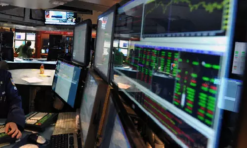 Wall St closes higher on eve of Fed decision; investors assess earnings