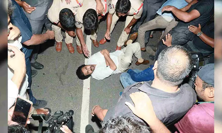 JSP chief Pawan lies down on road after being stopped at Andhra Border