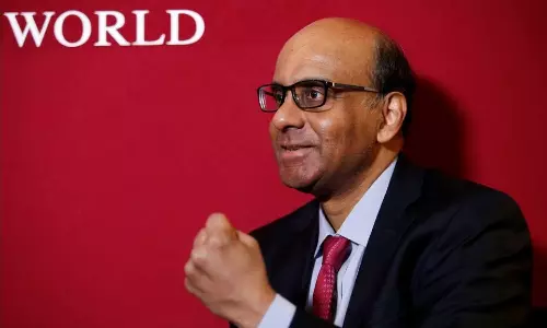Indian-origin economist Tharman Shanmugaratnam sworn in Singapores new Prez Indian-origin economist Tharman Shanmugaratnam sworn in Singapores new Prez