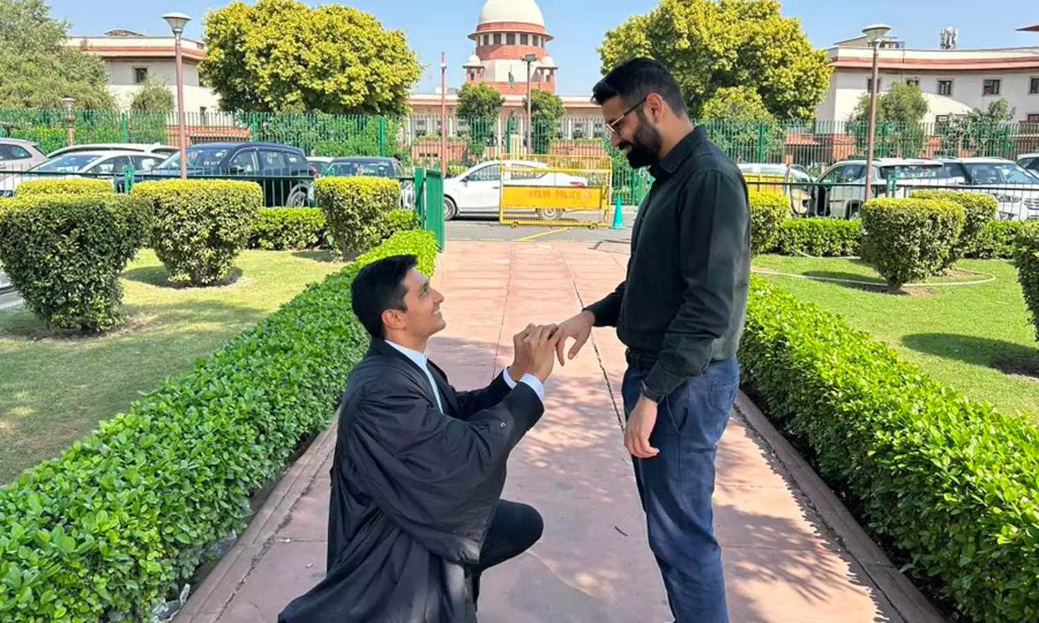 Gay couple exchanges rings in front of SC after judgement on same-sex marriage