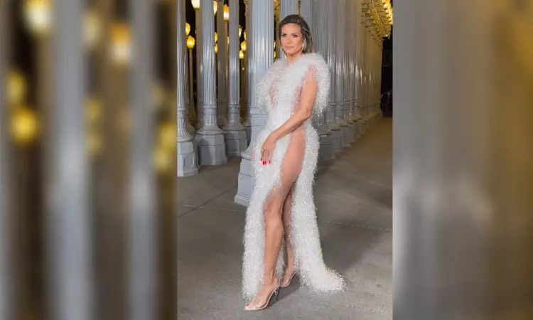 Heidi Klum slips into nearly nude look in cut-out plunging dress