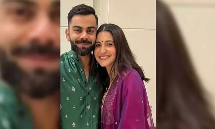 Anushka glows in pink as she poses with hubby Kohli at Team Indias Diwali bash