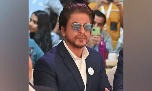 SRK looks dapper in blue suit at event in Delhi