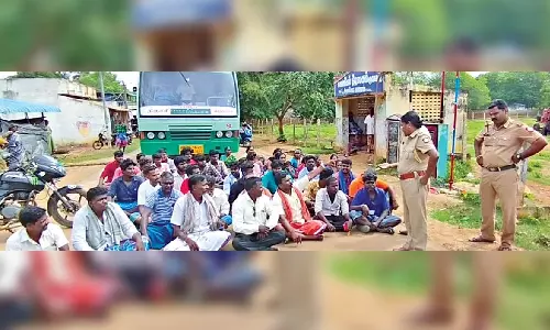 VCK cadre block Ariyalur road as miscreants burn party flag