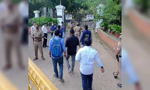 NIA officials inspect site outside Raj Bhavans main gate where petrol bomb was hurled