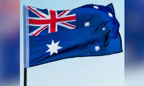 Higher tax earnings slash Australian budget deficit