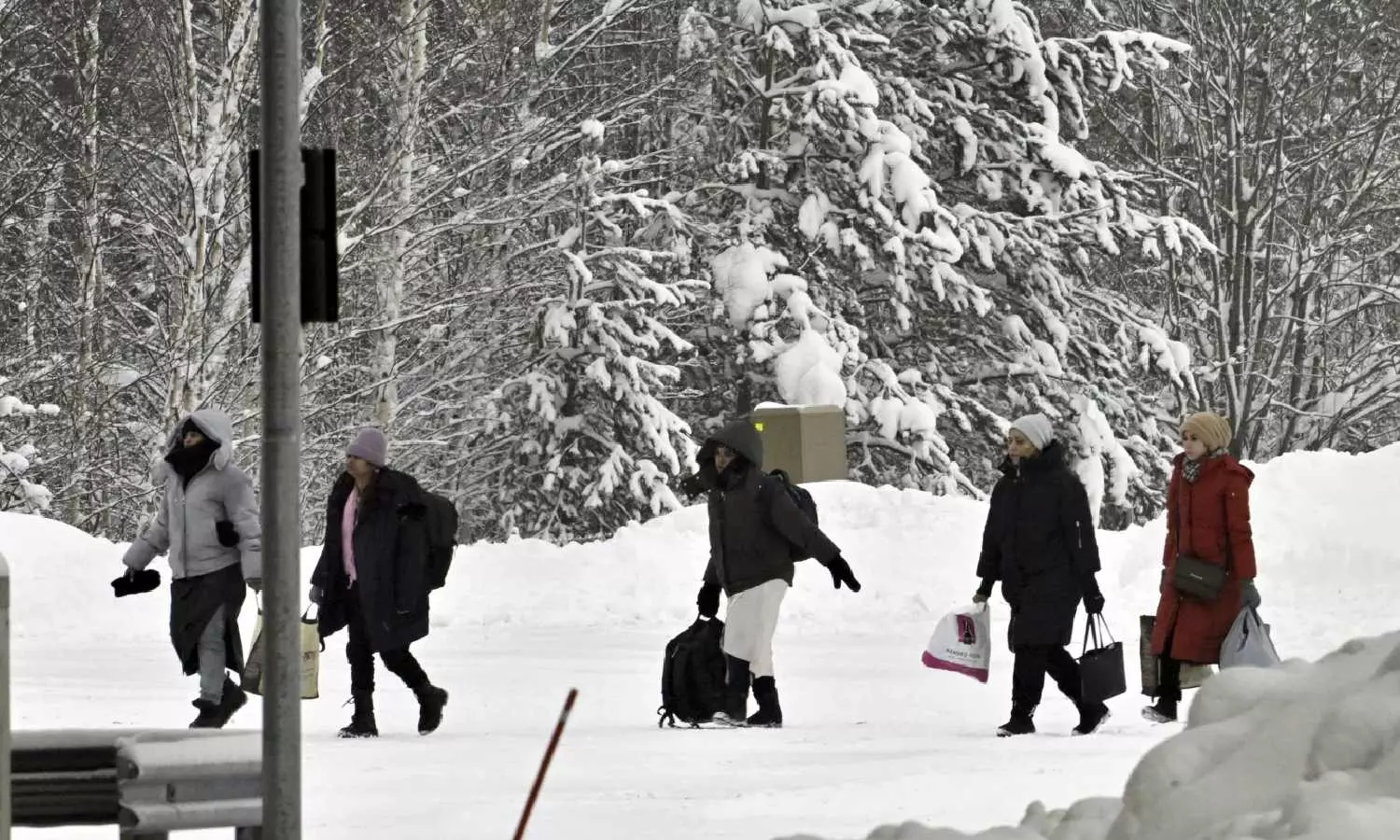 Finland reports a rush of migrant crossings hours before the reclosure of 2 border posts with Russia