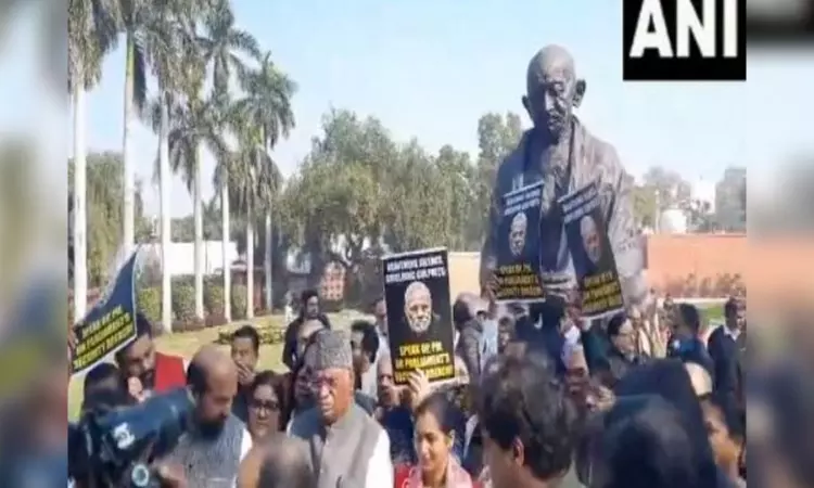 Oppn protests suspension of 92 MPs infront of Gandhi Statue in Parliament premises
