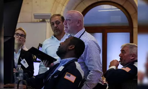 Stocks edge up, dollar eases before long holiday weekend