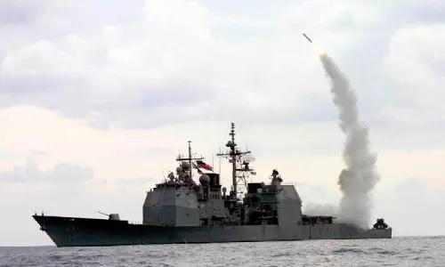 Japan Cabinet OKs record military budget to speed up strike capability