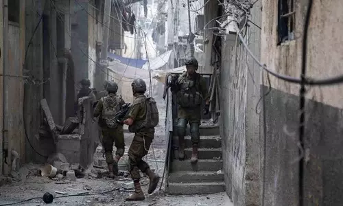 Israeli forces find tunnel shaft in Gaza school with photos of weapons