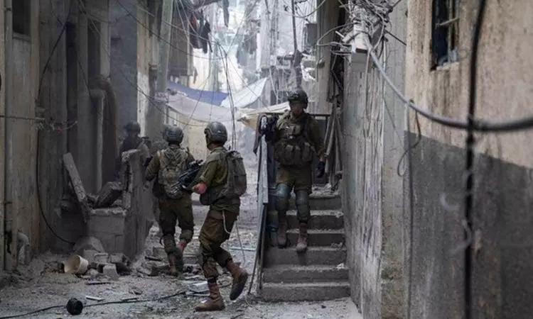 Israeli forces find tunnel shaft in Gaza school with photos of weapons