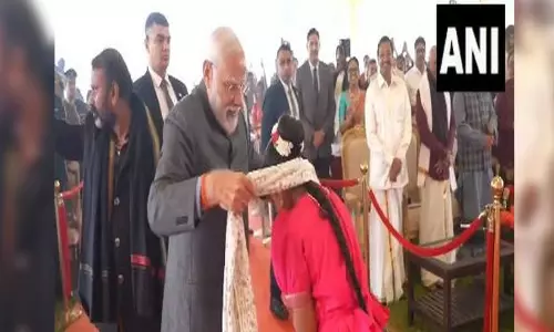 PM Modi gifts his shawl to girl during Pongal celebrations in Delhi