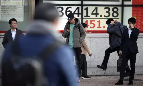 Stock market today: Asian shares follow Wall Street gains, Hong Kong stocks near 15-month low