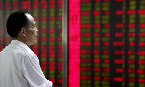 Asia stocks inch higher as China rebounds, dollar firm