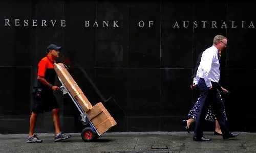 Australias central bank holds rates, warns further hike might be needed