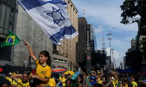 Former Brazil PM denies coup plot as thousands rally in his support