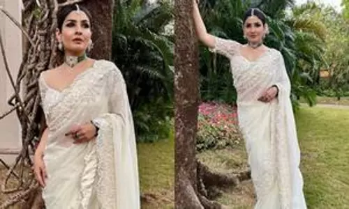 Raveena Tandon is a picture of elegance in white saree for wedding Raveena Tandon is a picture of elegance in white saree for wedding