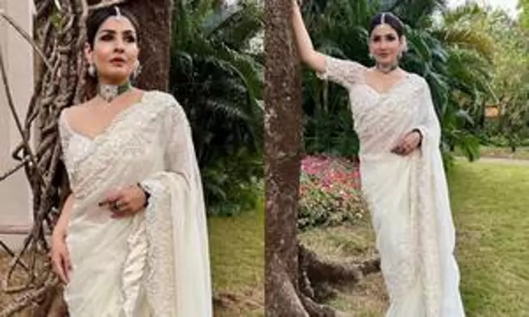 Raveena Tandon is a picture of elegance in white saree for wedding Raveena Tandon is a picture of elegance in white saree for wedding