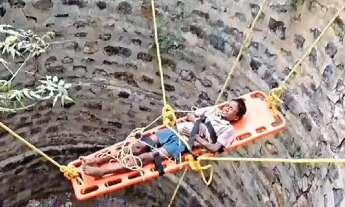 Fire personnel rescue boy from 30-foot well