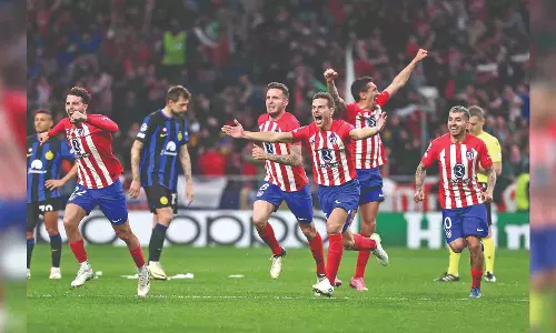 Atletico knocks out Milan on penalties to reach quarter-final