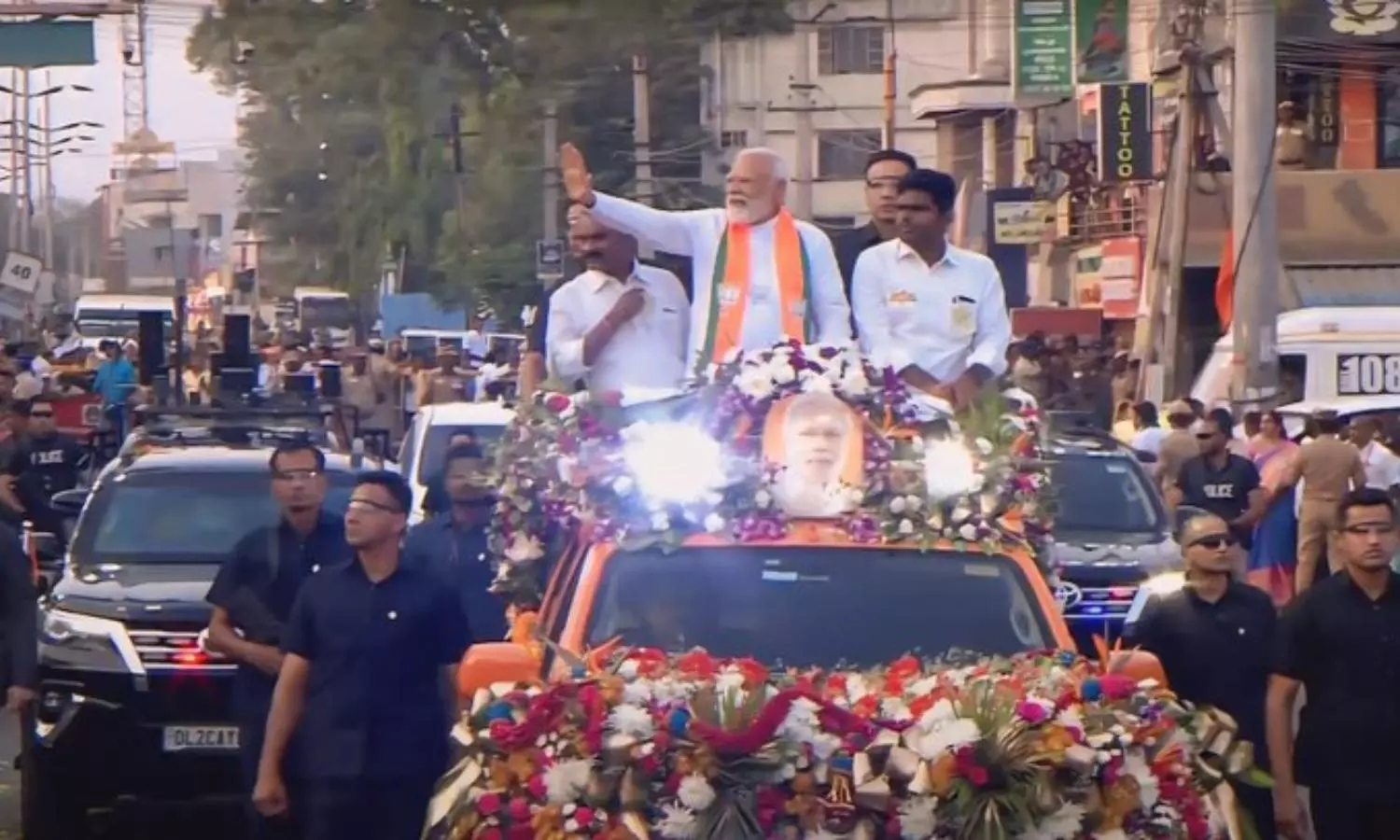 As Modi began his roadshow in an open vehicle,... ... PM Roadshow in Coimbatore live: BJP party-men chant slogans hailing Modi As Modi began his roadshow in an open vehicle,... ... PM Roadshow in Coimbatore live: BJP party-men chant slogans hailing Modi