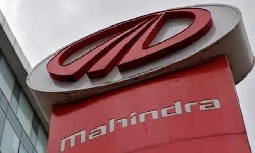 M&M, Adani Total Energies join hands to set up EV charging infra across India