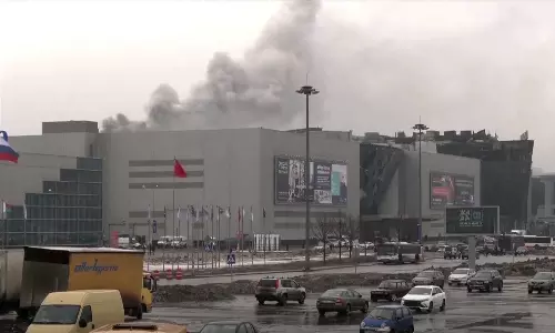 Russia arrests suspected gunmen as concert death toll soars to 143