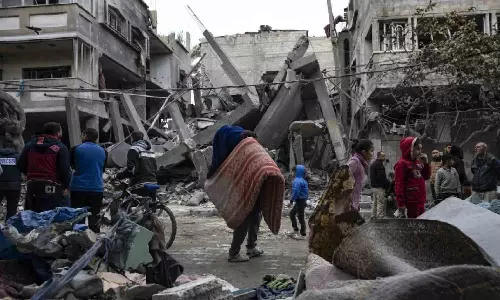 Palestinians describe bodies and ambulances crushed in Israel’s ongoing raid around Gaza hospital