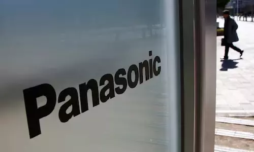 Panasonic to sell entire stake in autos business to Apollo Global-managed funds