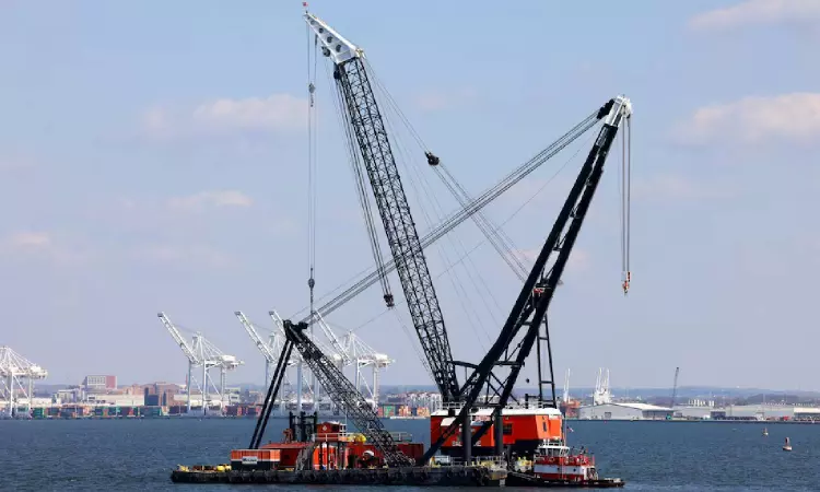 Massive crane put in place to clear Baltimore bridge debris as crews assess damage