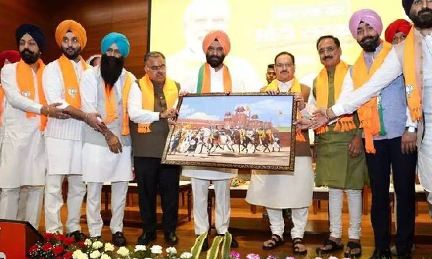 Large number of Sikhs, including DSGMC members, join BJP Large number of Sikhs, including DSGMC members, join BJP
