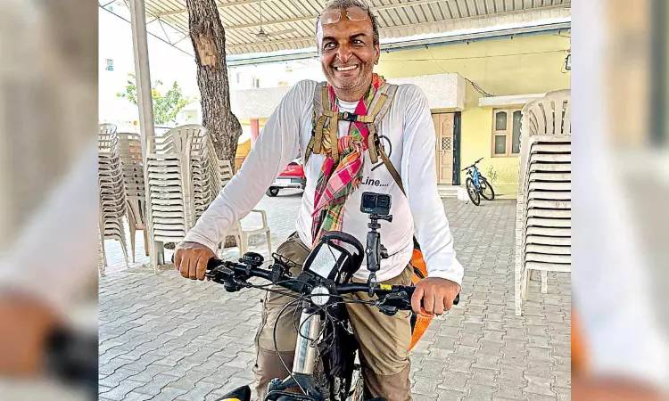 Professor pedals to raise climate change awareness