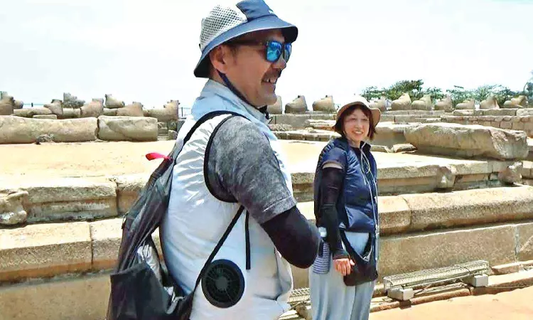 Pretty cool! Japanese couple in AC jackets turn head-turner at hot Mahabs Pretty cool! Japanese couple in AC jackets turn head-turner at hot Mahabs