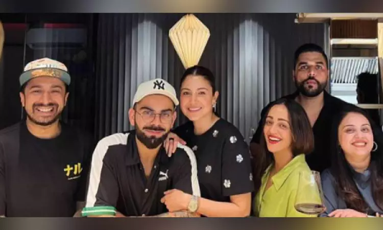 Anushka, Virat twin in black as they step out for date, poses with fans