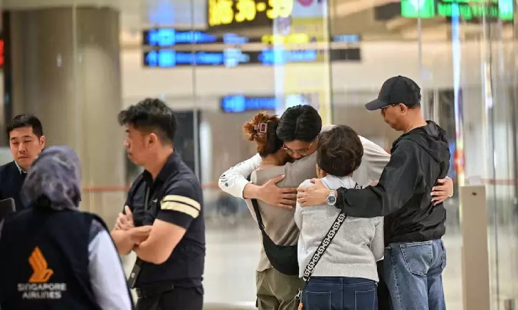 Shaken passengers arrive in Singapore after deadly turbulence-stricken flight