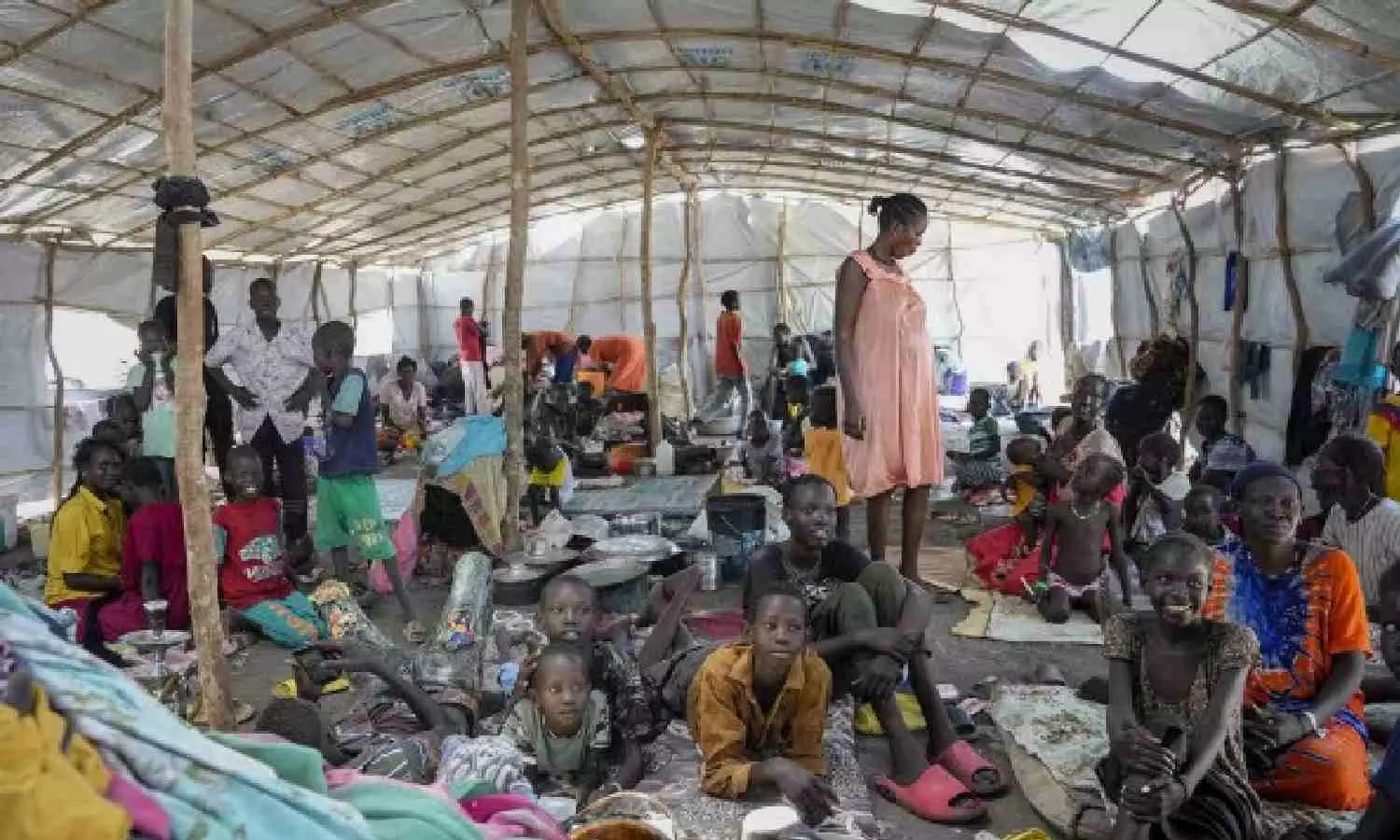 Aid group says over 100 people killed in 2 weeks of fighting in a Sudanese city