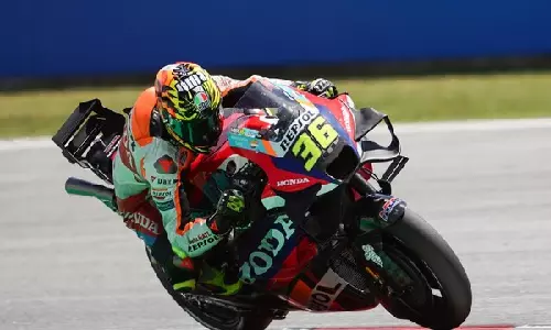 Repsol Honda Team battle track conditions in Catalan sprint